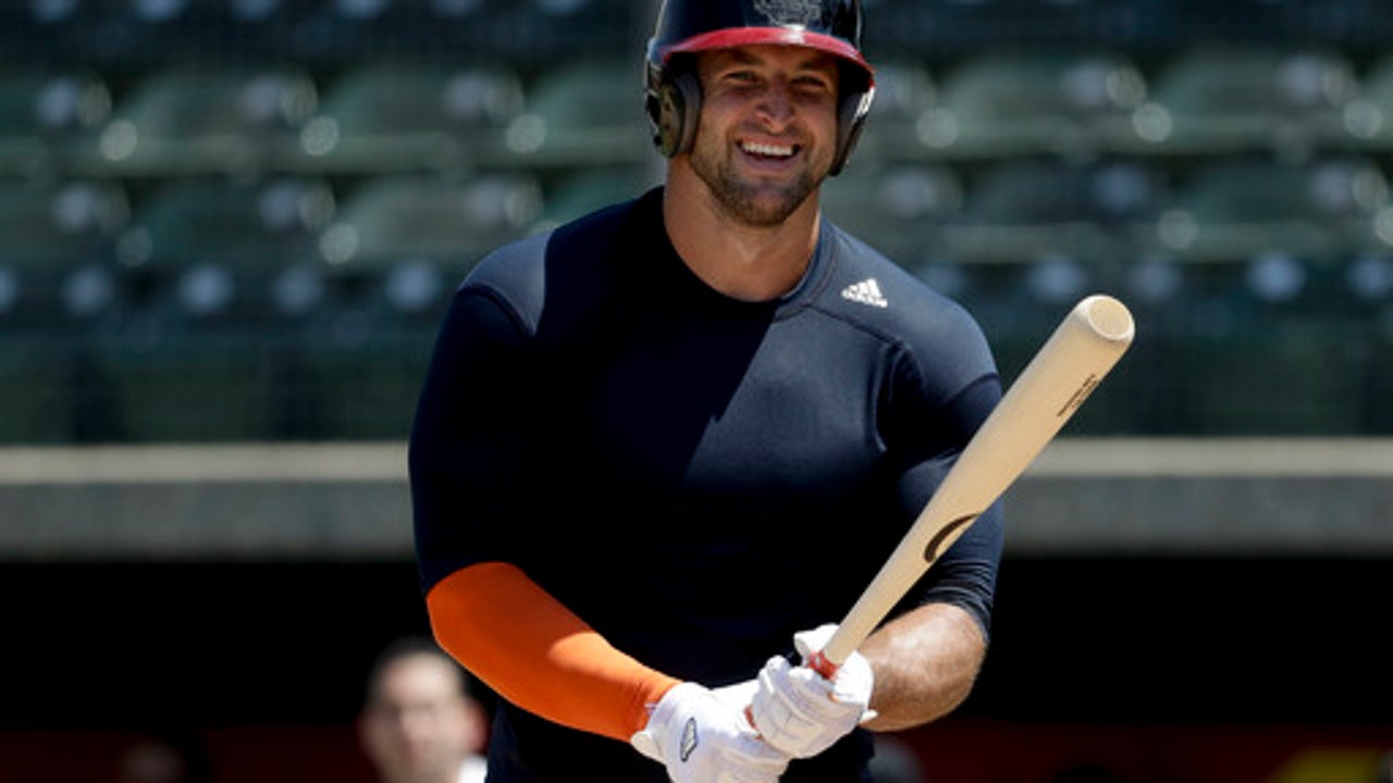 Determined to chase dream, Tebow shows power in MLB workout